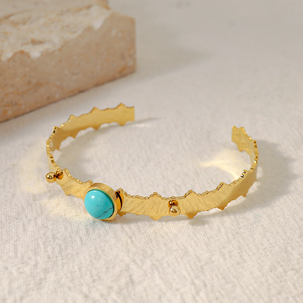 A Maramalive™ gold cuff bracelet with a Blue Turquoise Natural Stone Edge Titanium Steel Electro-plated Bracelet.