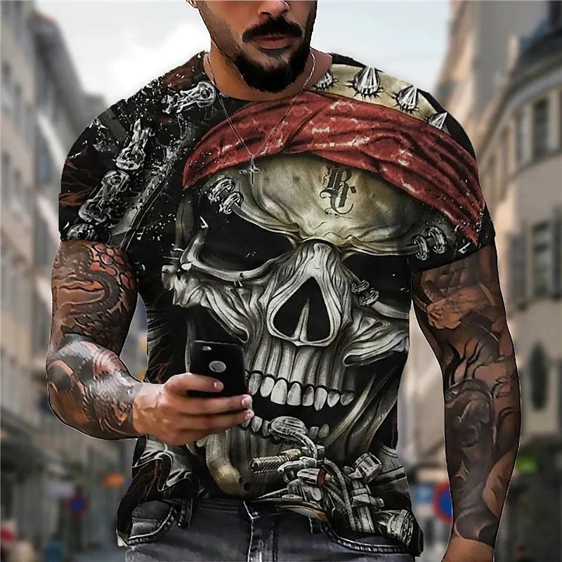 Man wearing a 3D Printed Men's Crew Neck Casual T-shirt by Maramalive™ with a large skull and skeleton design stands on a city street, holding a smartphone. The 3D Printed Men's Crew Neck Casual T-shirt, crafted with digital printing technology, features a red bandana on the skull and intricate tattoo designs on the man's arms.
