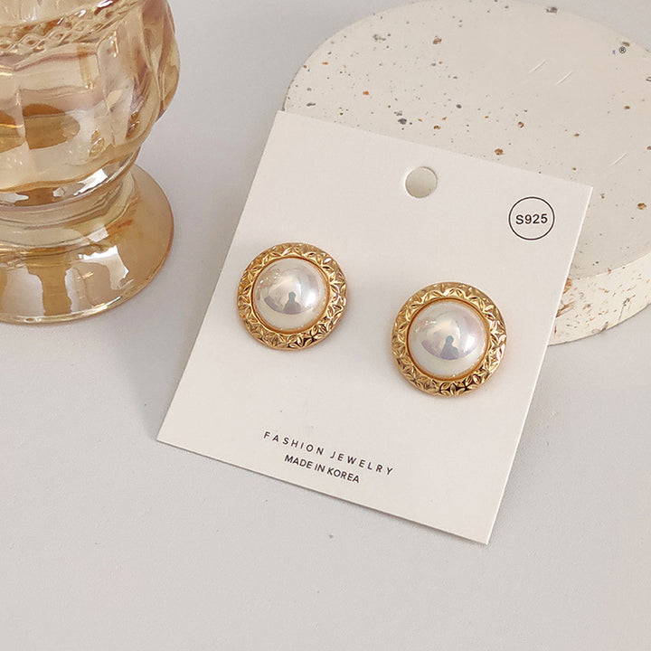 A pair of French Retro Pearl Earrings by Maramalive™, gold plated stud earrings.