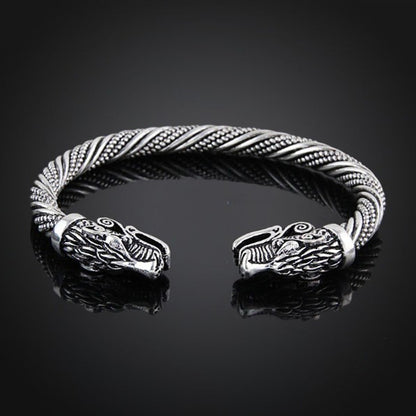 A close up of a Maramalive™ Viking Rune Dragon Bracelet on a table.