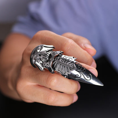 A person holding a Dragon Ring Alpha Male Punk Street Men's Ring by Maramalive™ with a skull on it.