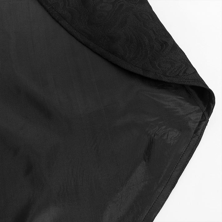 Close-up view of the hem of a black, sheer fabric with a subtle pattern, lying flat—perfect for those who appreciate the elegance of neutral clothing. Men's Retro Gothic Style Swallowtail Mid-length Jacquard Blazer by Maramalive™.
