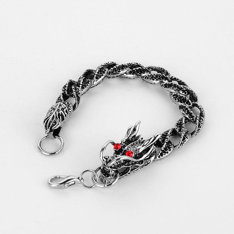 A person wearing a Men's Dragon Super Cool Grain Titanium Steel Bracelet with a dragon on it made by Maramalive™ brand.