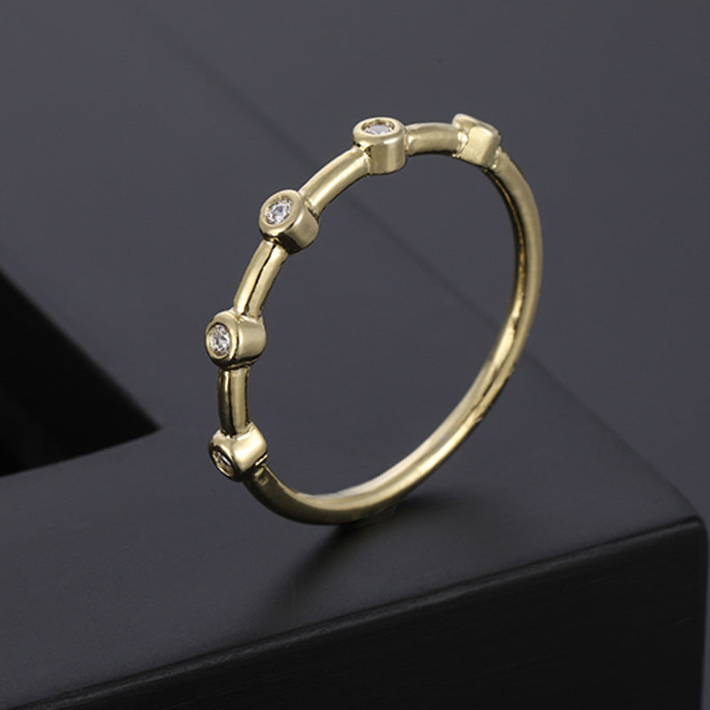 A Maramalive™ Minimalist Gold Diamond Wedding Ring.