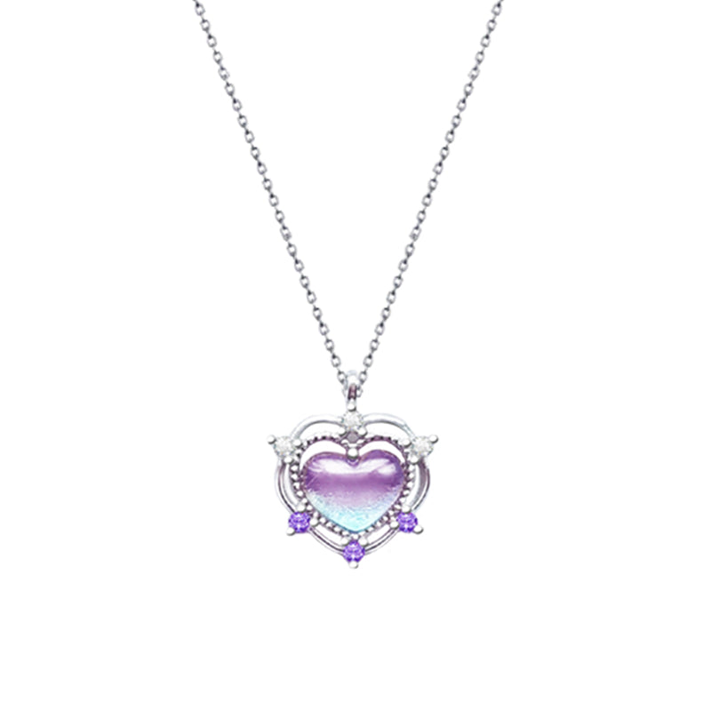 A woman is wearing a Maramalive™ Sterling Silver Peach Amethyst Heart Necklace.