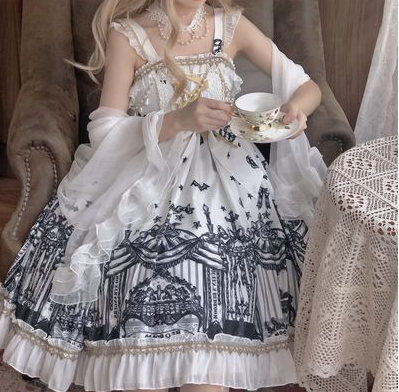 A girl is sitting in a chair holding a cup of tea with a Maramalive™ Revival Dress: Reborn in Style, featuring a Gothic lace and leather look.