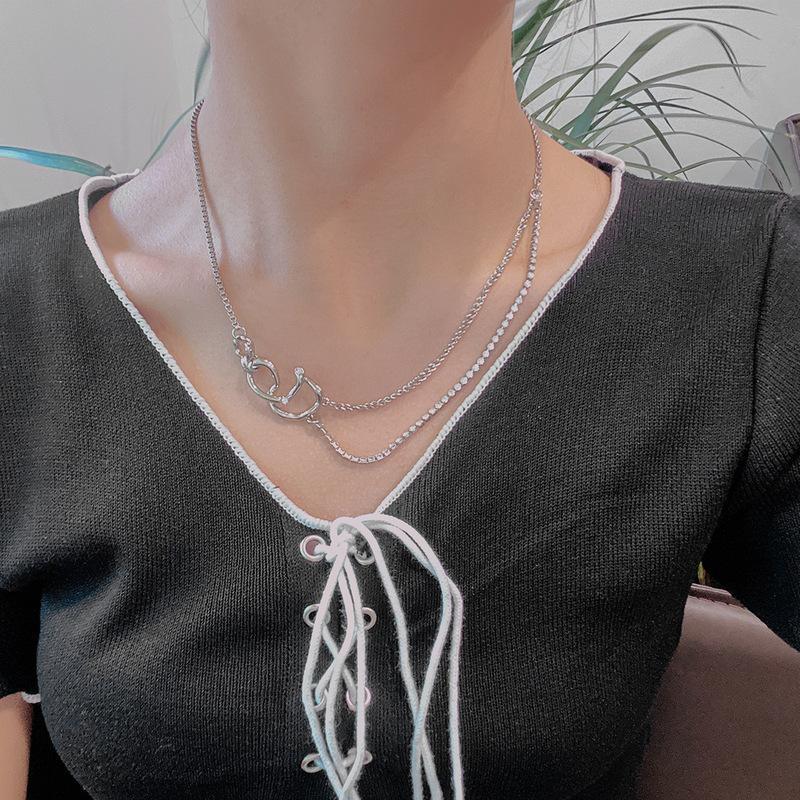 A woman wearing a black top and a Maramalive™ Hip-hop Clavicle Chain Design.