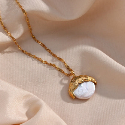 A woman wearing a Maramalive™ gold turtleneck and a necklace with a moon on it.
