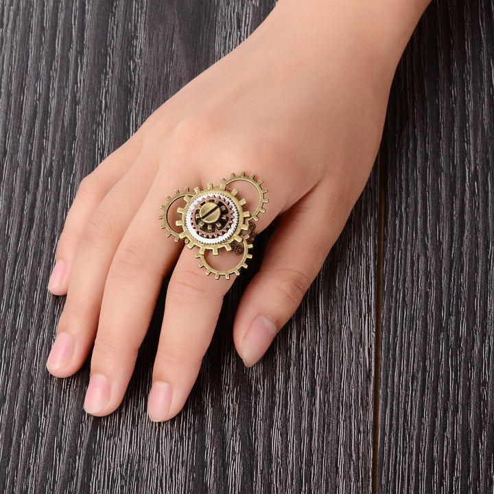 A woman's hand with a Maramalive™ Retro Steampunk 3 Ring Gear Ornament on it.