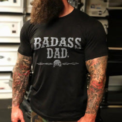 A man with a beard and tattoos wearing a Skull Explosion Print T-Shirt that says badass dad, made by Maramalive™.