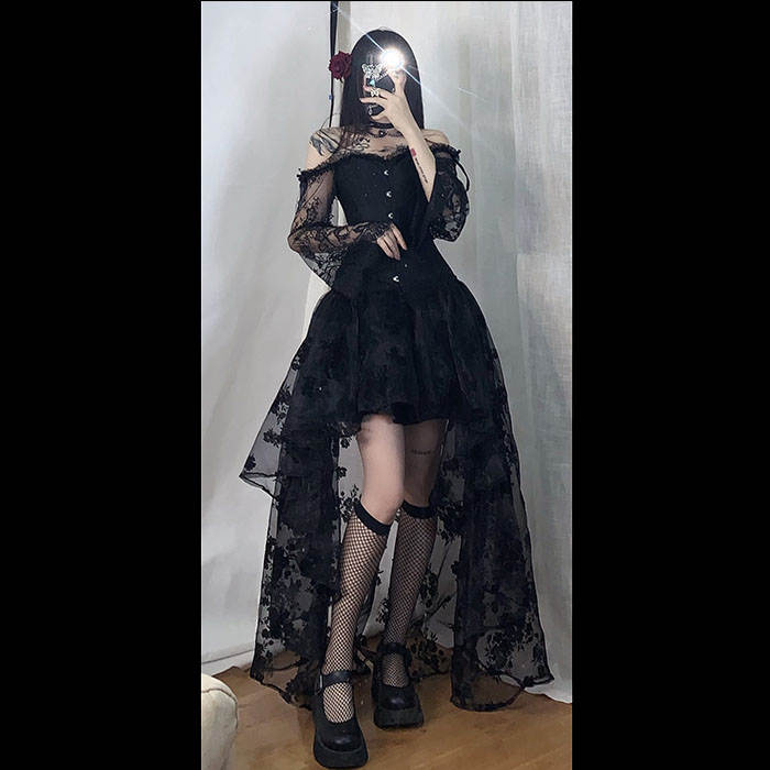 A woman in the Maramalive™ Dress to Rule the Dark Kingdom - Sinister Royalty Corset Gown and stockings.