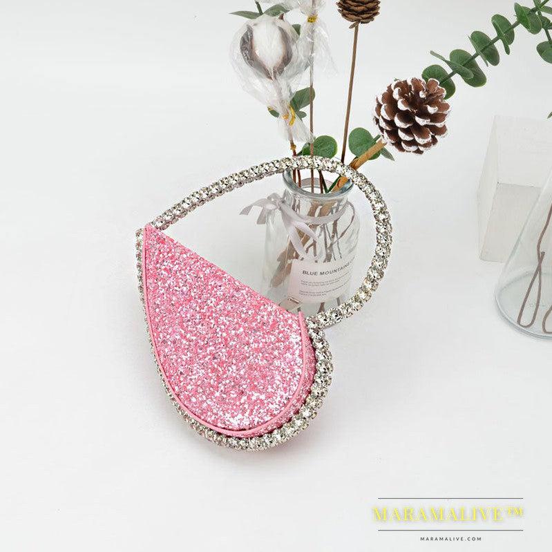 Diamond studded dinner bag with diamond heart-shaped clutch