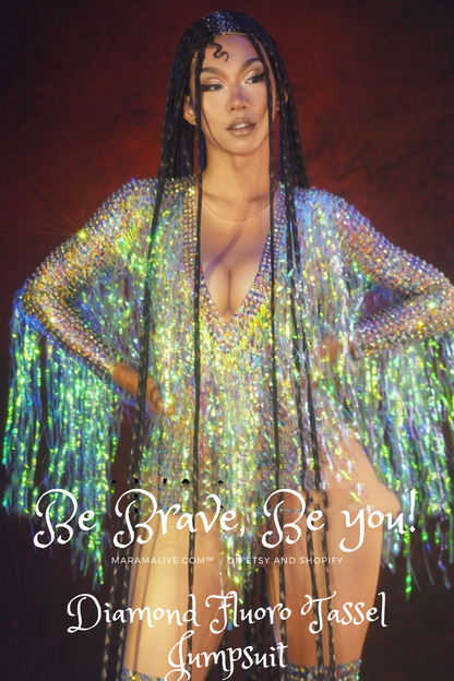 A woman in a Maramalive™ Colorful Diamond Fluorescent Tassel Jumpsuit posing on stage.