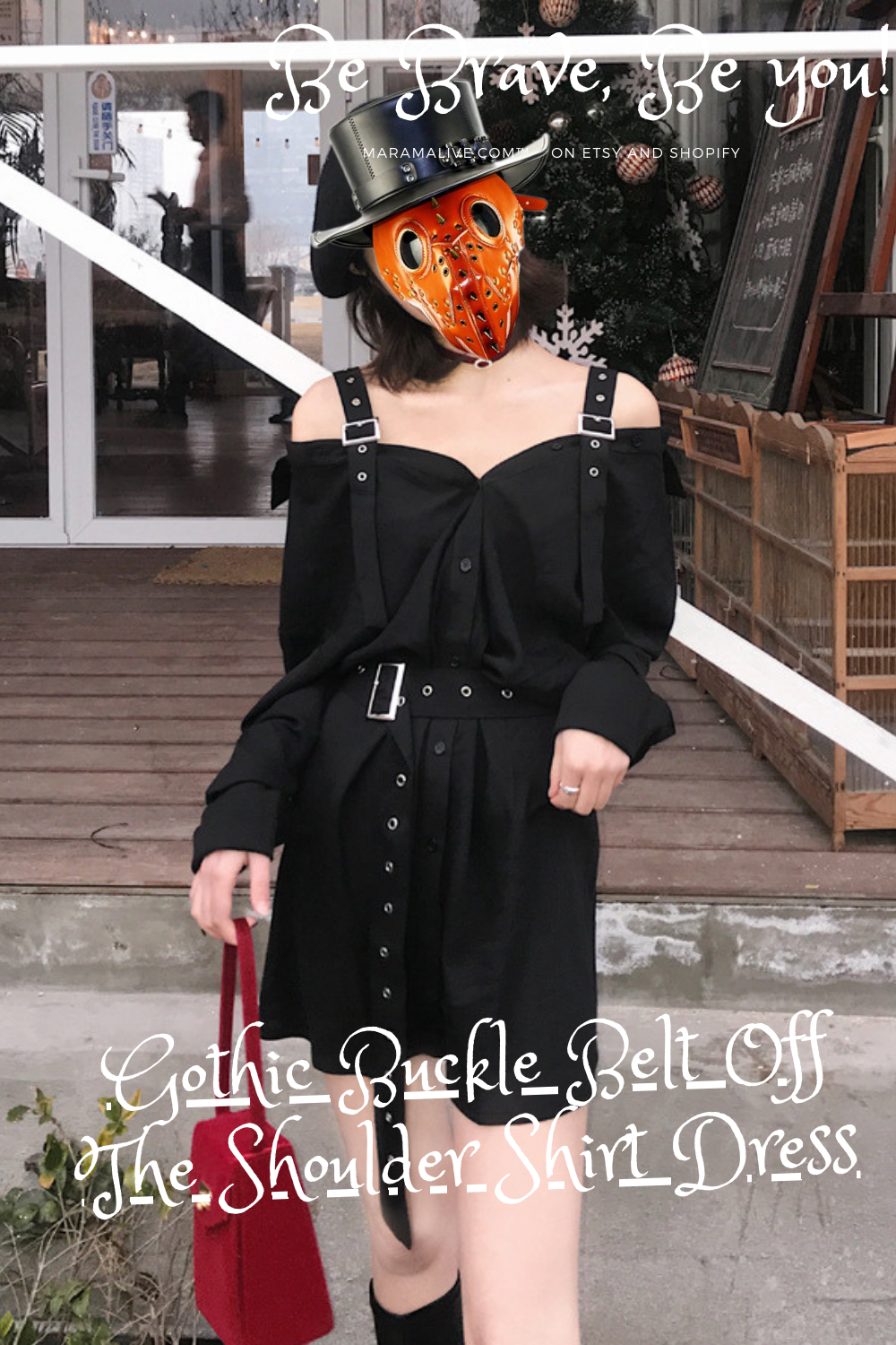 A woman wearing a Maramalive™ Little Black Dress - Unique belts & Straps Cute Minidress with an orange mask.