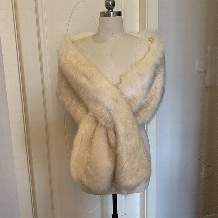 A mannequin showcases a light beige Maramalive™ 30 colors Women Fur Capes Champagne Wedding Bolero Faux Fur Stole Bridal Jacket Formal Party Shrug Walk Beside You De Mariage with a crossed front, perfect as one of those elegant bridal wraps, situated in front of a patterned wallpaper.
