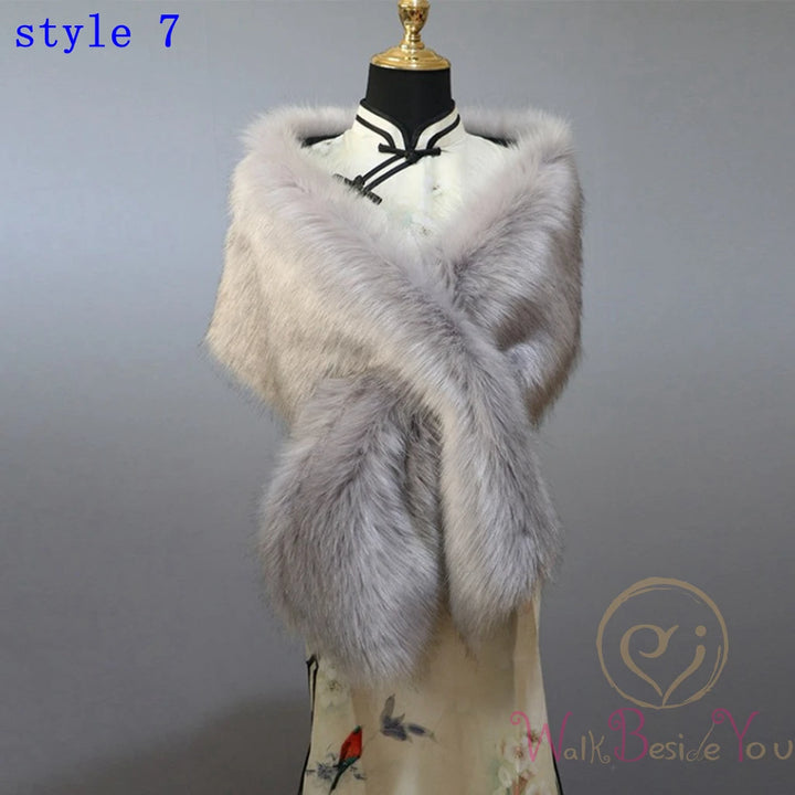 "Mannequin showcases elegant faux fur cape. grey