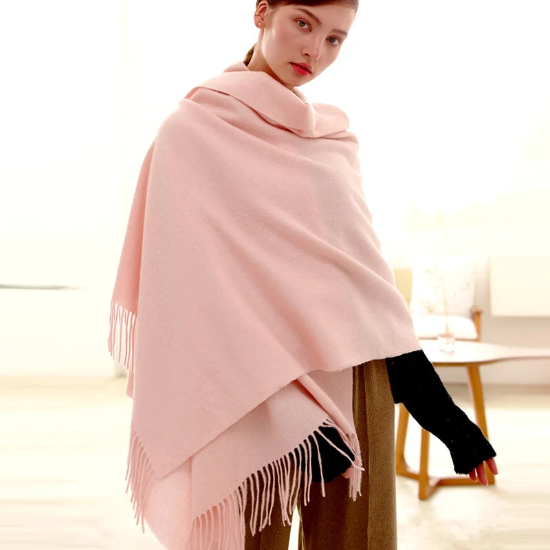 Woman in thick pink knitted winter scarf
