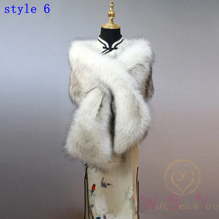 "Mannequin showcases elegant faux fur cape. white and black