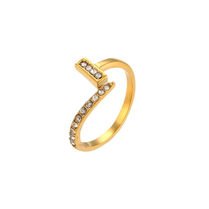 A woman's hand holding a Simple Temperament Ring Special Interest Light Luxury Non-titanium Steel Plated 18K Gold with diamonds by Maramalive™.