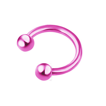 A group of different colored Maramalive™ C-Shaped Nose Stud: Anti-Allergy Horseshoe Rings on a table.