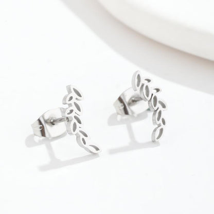 A pair of Stainless Steel Studs Simple Hollow Wheat Earrings for Women by Maramalive™ on a white plate.