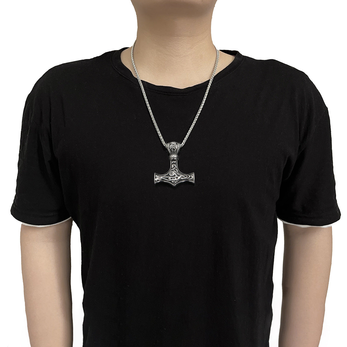 Viking - Thor's Hammer Pendant | Titanium Steel Necklace worn by a boy in a black t-shirt