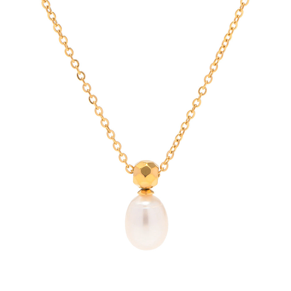 A Maramalive™ Personalized Simple Niche Cross Pearl Necklace For Women with a white pearl on top of a stone.