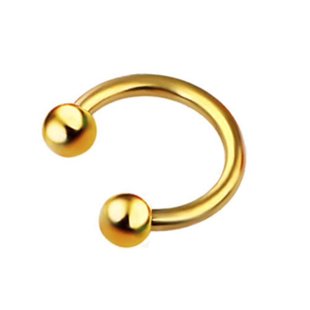 A group of different colored Maramalive™ C-Shaped Nose Stud: Anti-Allergy Horseshoe Rings on a table.
