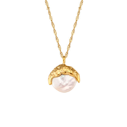 A woman wearing a Maramalive™ gold turtleneck and a necklace with a moon on it.