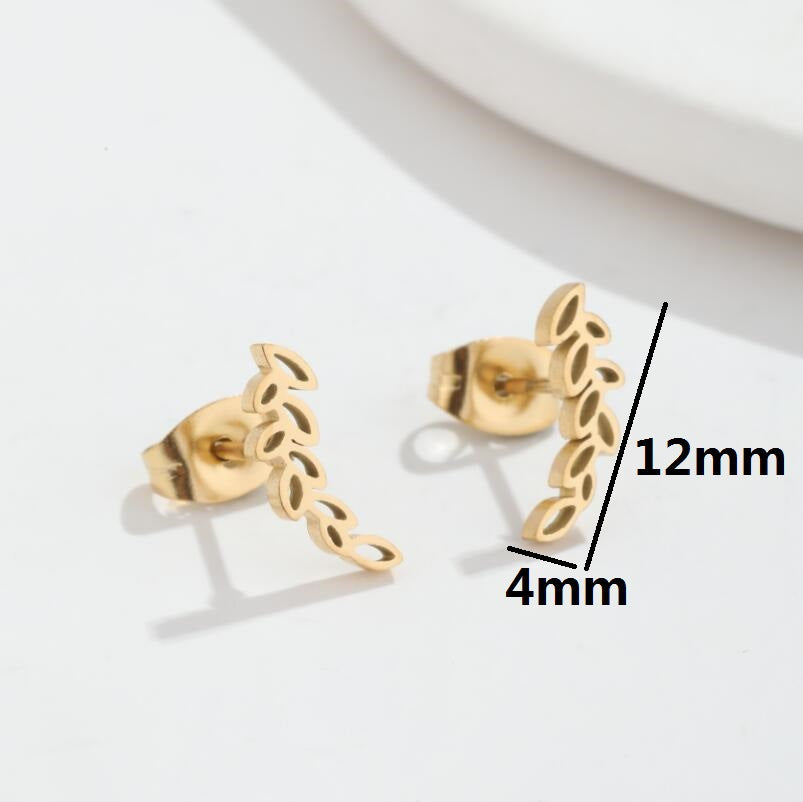 A pair of Stainless Steel Studs Simple Hollow Wheat Earrings for Women by Maramalive™ on a white plate.