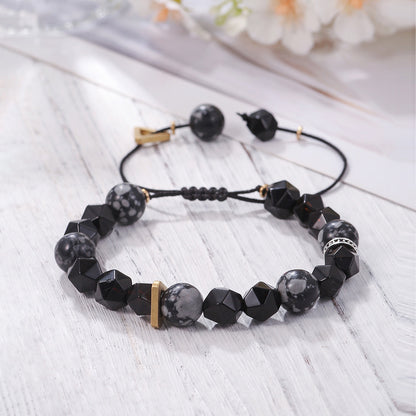 A Vintage 10mm Volcanic Rock Beaded Braided Rope Bracelet Men by Maramalive™ with black and gold beads.