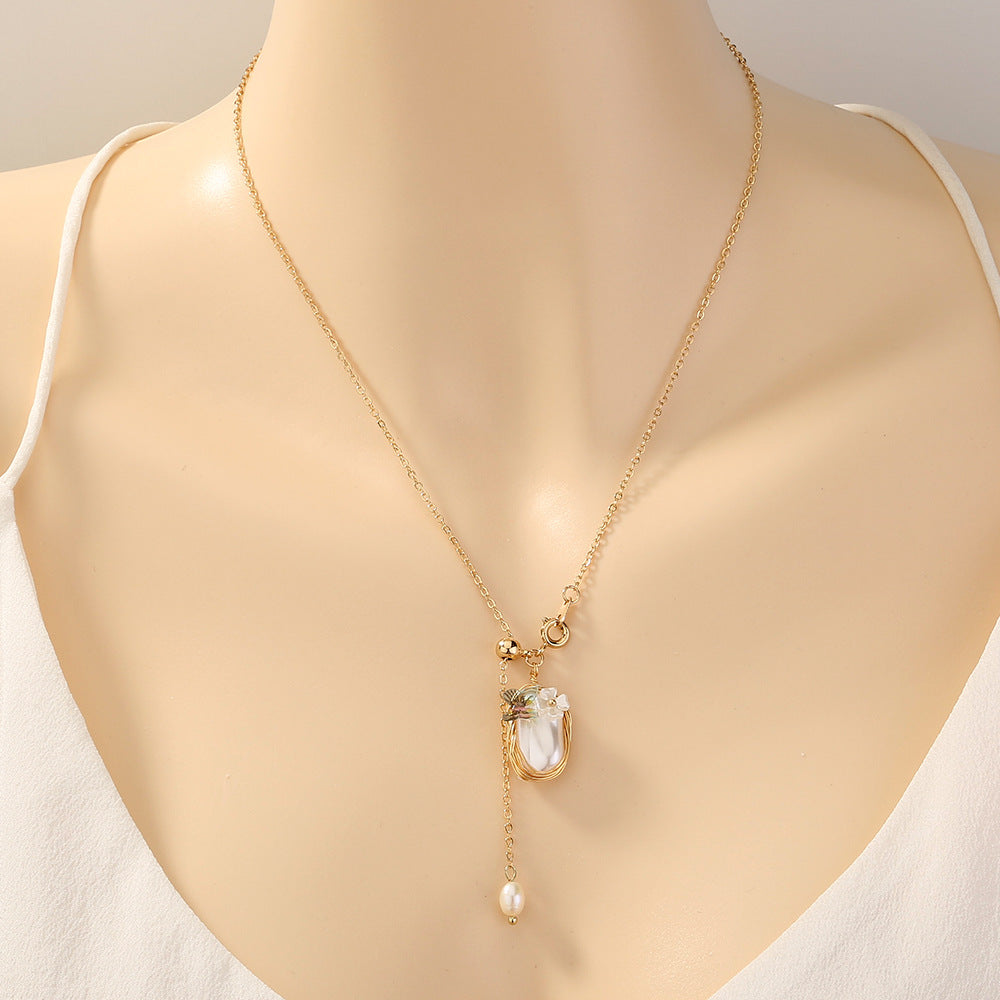 A mannequin wearing a Maramalive™ Women's Fashion Vintage Court Style Pure White Pearl Green Natural Stone Pendant Necklace for protection.