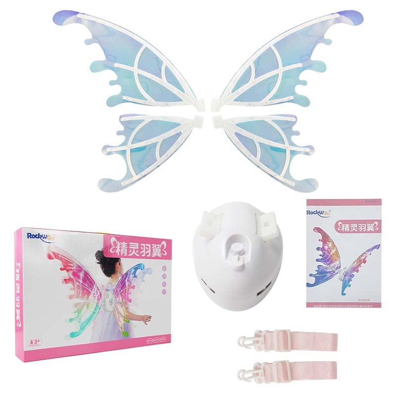 A little girl in a fairy costume standing next to a table wearing Maramalive™ Electric Wings Luminous Elf Wings FARCENT Angel Wings Children's Outdoor Stage Props.