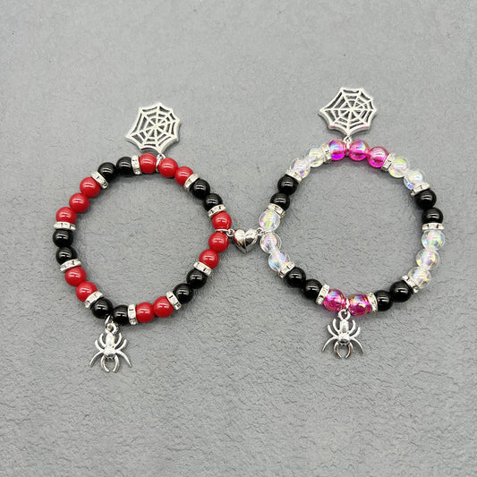 Two Maramalive™ Bewitching Baubles for Two adorned with spider charms, perfect for Halloween haunt.