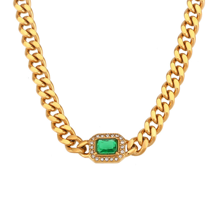 A woman wearing a Fashionable All-match Stainless Steel Cuban Link Chain Zircon Bracelet necklace and bracelet with emerald topaz by Maramalive™.