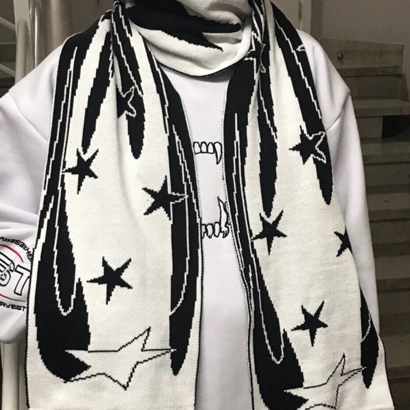 A person is wearing a Maramalive™ European And American Scarf Autumn And Winter New Dark Style Fire Element, a stylish winter accessory crafted from viscose fiber, over a light-colored sweatshirt. Stairs are visible in the background.