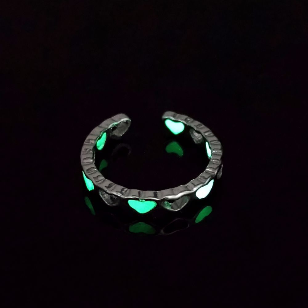 A Maramalive™ Creative Glow Accessories Personalized Creative Luminous Ring on a black background.