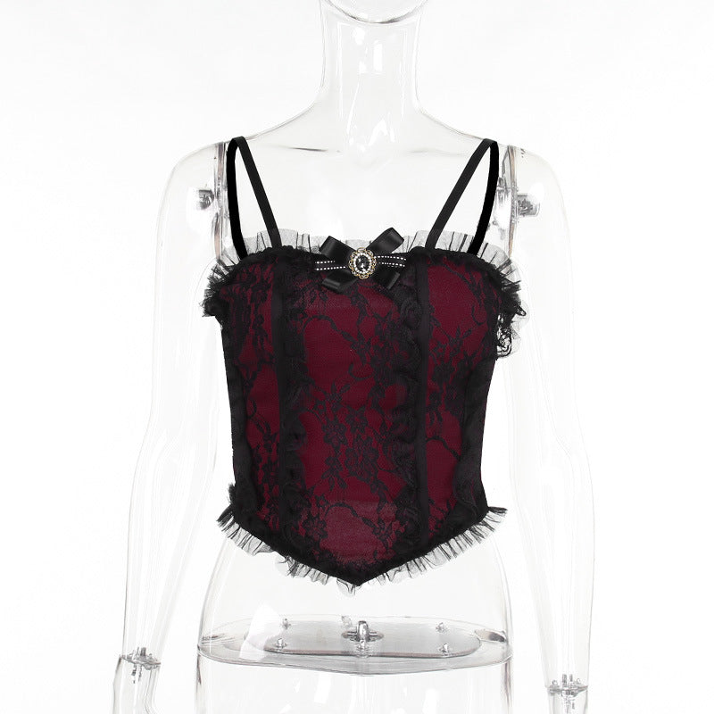 A transparent mannequin wearing a Dark gothic lace camisole | Dark romantic lace top by Maramalive™, featuring thin shoulder straps and a decorative bow on the front.