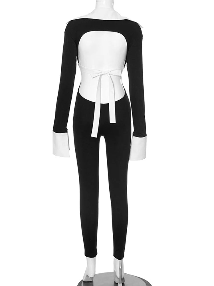 "Mannequin models chic, long-sleeved, black and white romper."