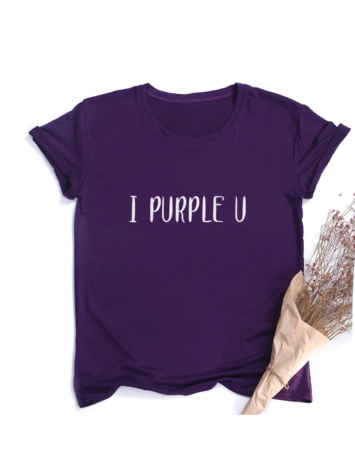 A purple T-shirt with the text "I PURPLE U" printed on the front, perfect for your Spring/Summer Tees collection. This casual women's T-shirt is made from comfortable polyester broadcloth and is laid flat next to a wrapped bundle of dried flowers. The Maramalive™ Female Short Sleeve KPOP I PURPLE U T-shirt Aesthetic High Quality Haut Femme Summer Top Tee Shirt Streetwear Cute Tshirts adds a stylish touch to any wardrobe.