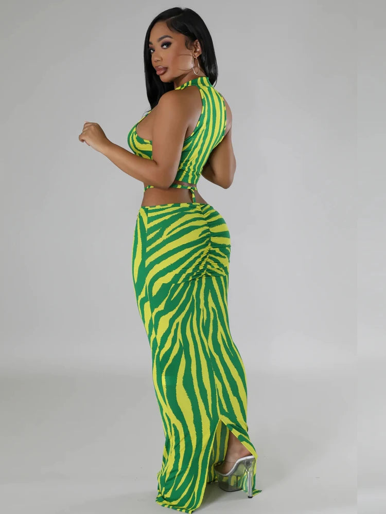 Model wearing a crop top and matching skirt in Summer Tropical colors