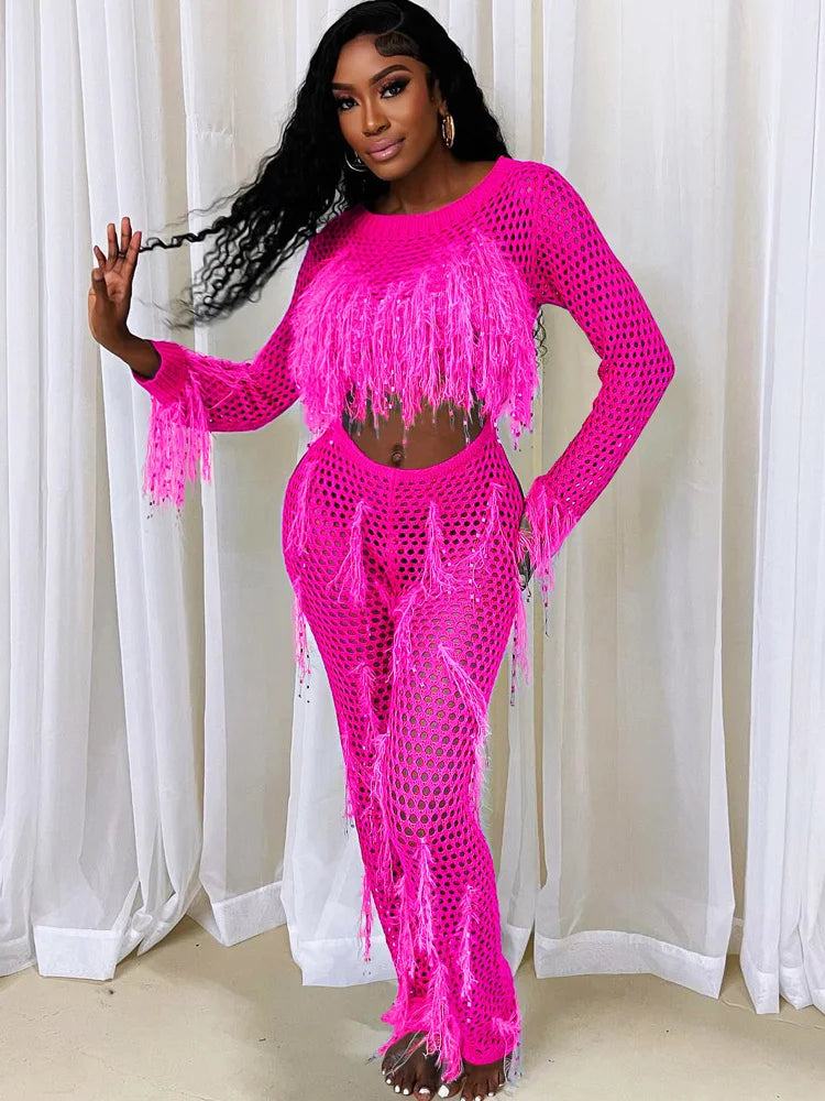 49086425202962|49086425301266|49086426186002|49086426284306"Model in sparkly, sequined tassel PINK jumpsuit."