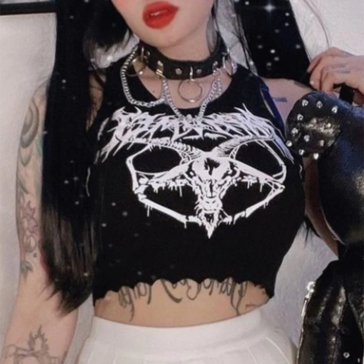 A person wearing a black, sleeveless top with a goat skull design and a spiked black choker and layered chain necklace. The individual has tattoos on their arms, dark hair, and is holding a studded item. The edgy ensemble exudes the bold vibe of Maramalive™ Black Tank Tops For Women Knitted Grunge Punk Goth Goat Head Print Vest Y2k Clothes Crop Top Summer Sexy Sleeveless O-neck Tanks.