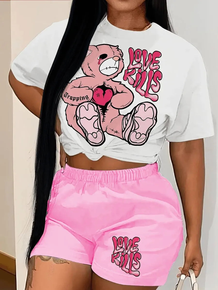 Person wearing a white t-shirt from Maramalive™ with a teddy bear graphic and the words "Love Kills," paired with pink shorts featuring the same phrase. This casual style outfit offers both a high stretch fabric for comfort and an edgy, trendy look.