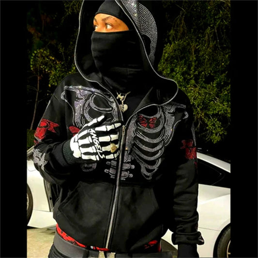 A person dressed in a black Maramalive™ Goth Clothing Rhinestones Skeleton jacket Hoodies Punk Long Sleeve Streetwear Oversized Zip Men Y2K Casual Hoodie Sweatshirt New and mask, embracing a punk style, stands outdoors in front of a white car with spring greenery in the background.