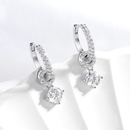 White gold moissanite drop earrings for women.