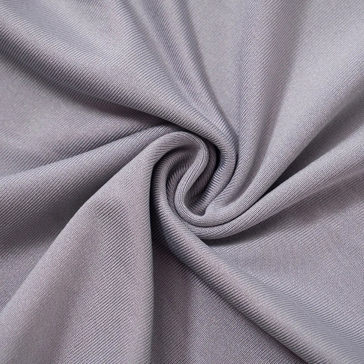 A close-up view of a twisted piece of light grey fabric with a smooth, woven texture, reminiscent of the material in the Maramalive™ 2023 Women Fashion Tight Jogging Sports Hoodie Autumn Solid Color Casual Hooded Long Sleeve Slim Pleated Top Urban Style.