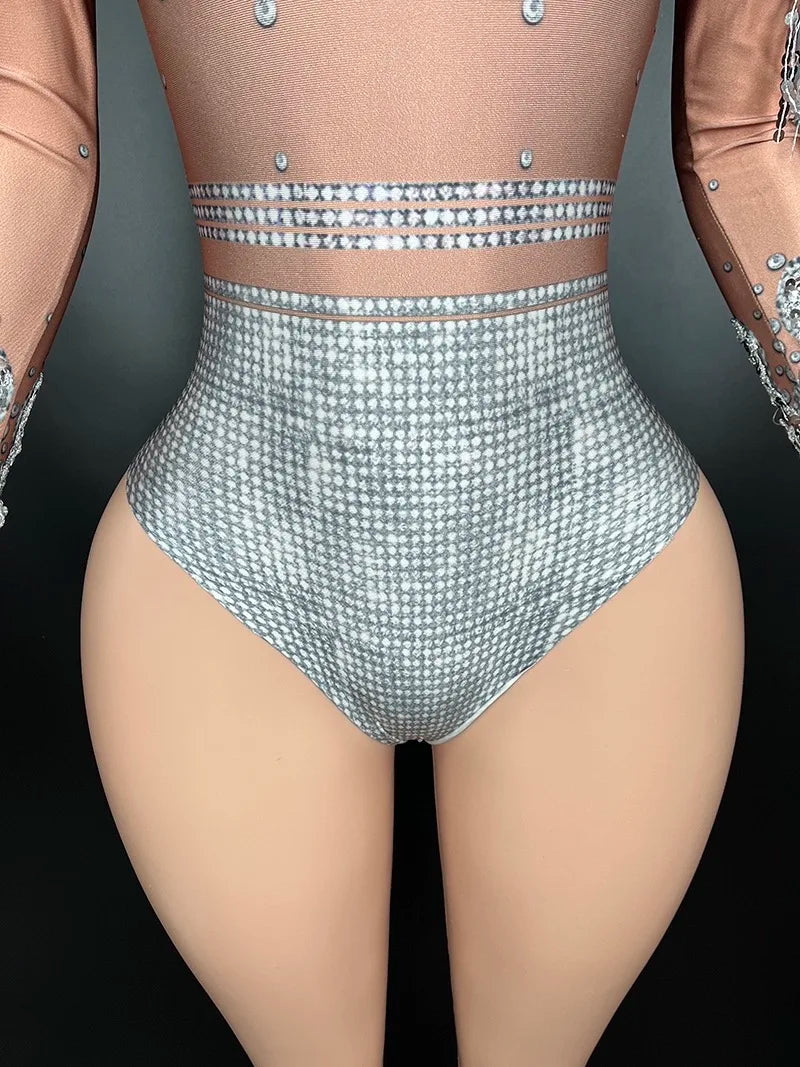 A close-up of a person wearing a Maramalive™ Flashing Silver Sequins Fringe Spandex Bodysuit Women Dancer Singer Performance Costume High-Neck Long Sleeve Nightclub Stage Wear with detailed embellishments on the sleeves and upper body.