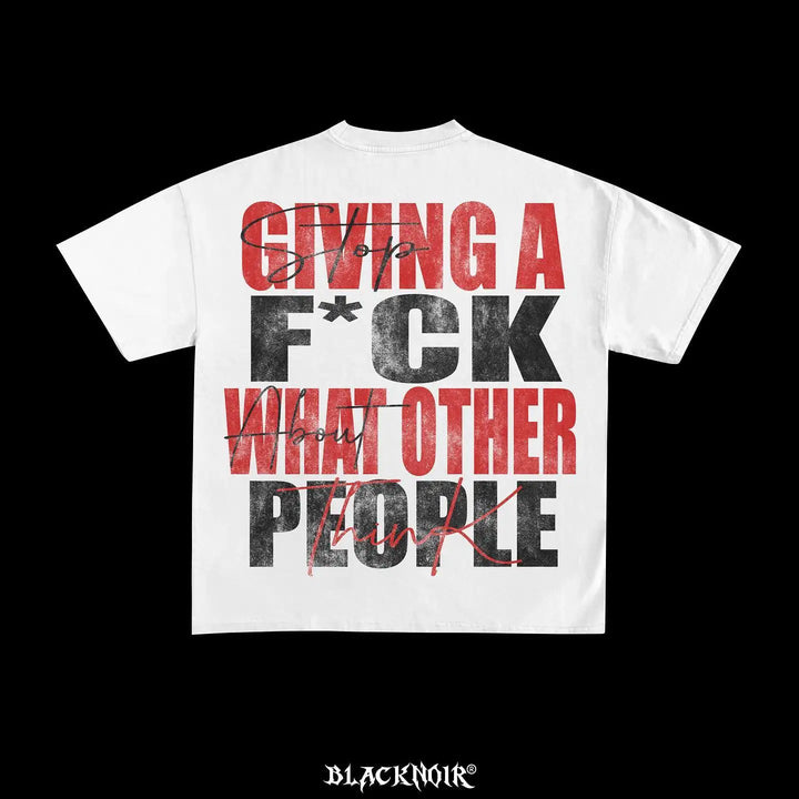 A high-quality, oversized white cotton T-shirt featuring large red and black graphic 2023 text on the back: "Giving a f*ck what other people think." The brand name "Maramalive™" is displayed at the bottom of this bold goth-inspired design.