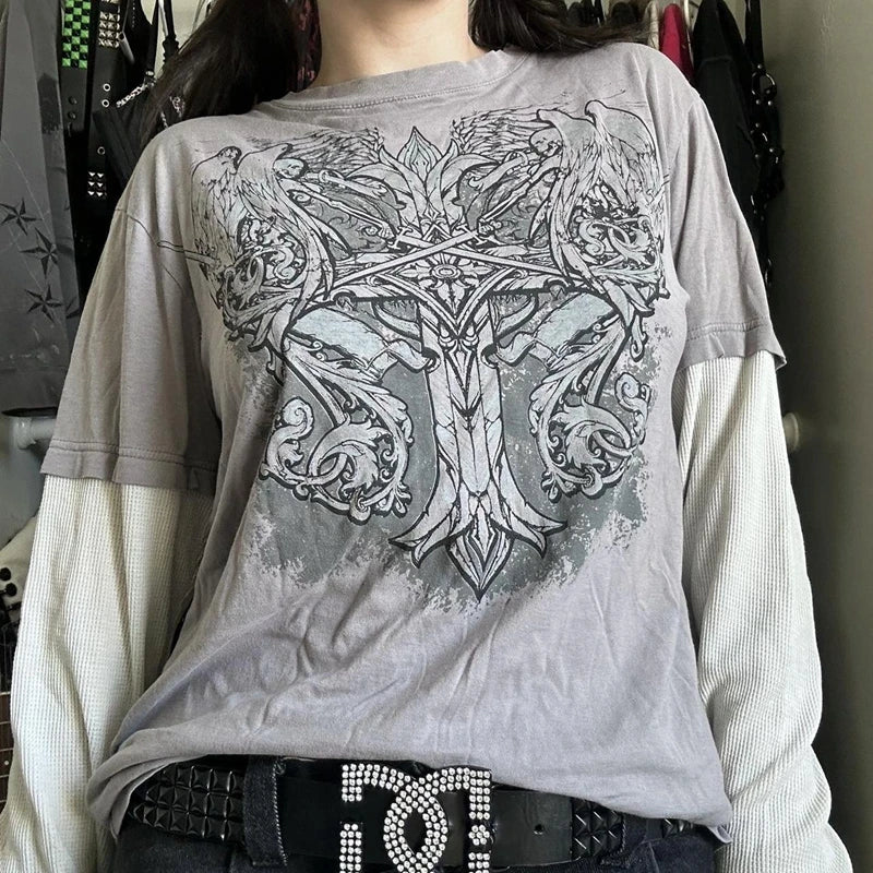 Person wearing a layered long-sleeve shirt and an ornate 2000s Retro Mall Goth Graphic Print Loose Tops Cyber Y2K Grunge Vintage Oversize T-shirt Fake 2 Pice Patchwork Long Sleeve Tees by Maramalive™. The belt features a large, embellished clasp in true Y2K style.